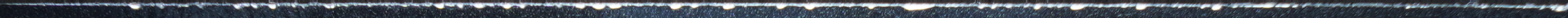 The same Luka Doncic edge under low-angle side rake lighting