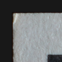 The same Wayne Gretzky corner with an inward crease visible under rake lighting